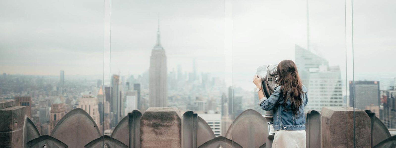 producer price, U.S. Economy Surges , significant growth, DJIA dipped, wall street resurgence, woman in blue denim jacket standing on top of building